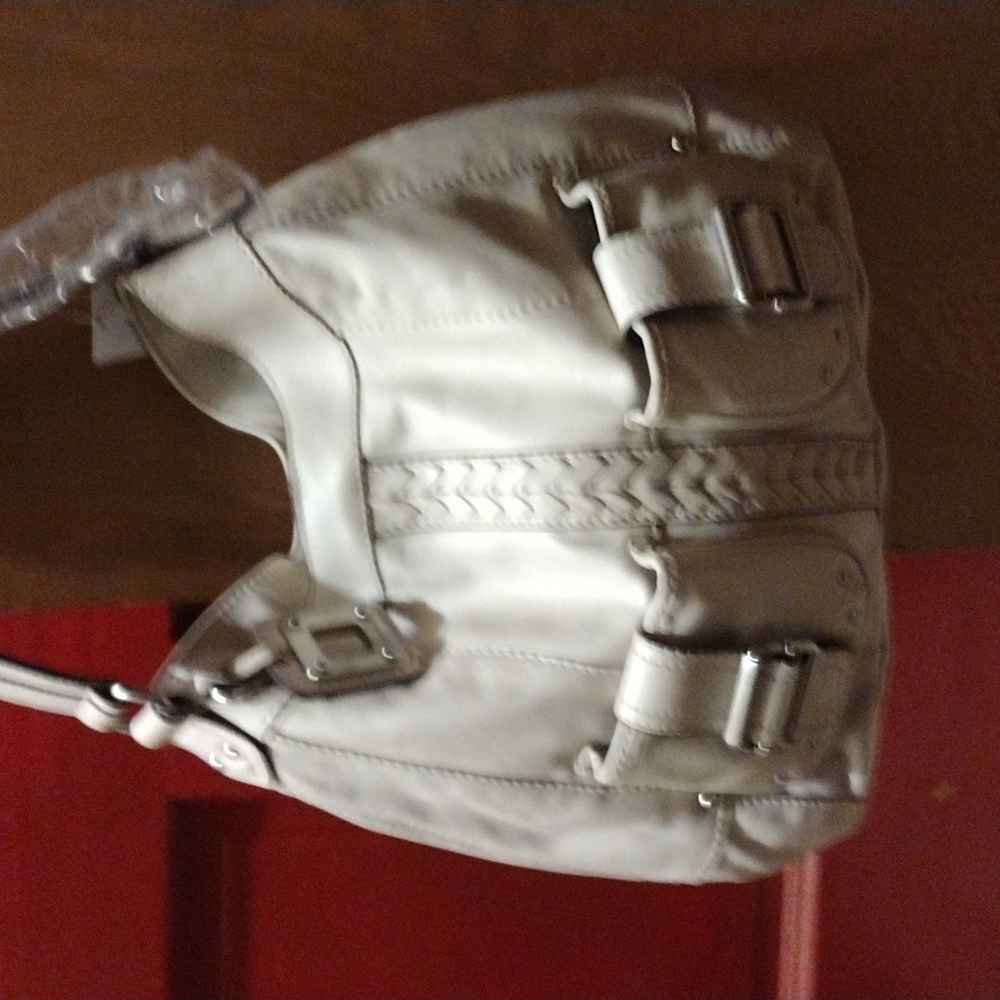 Tignanello leather hobo with front pockets.
